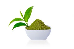 Powder green tea in small bowl and green tea leaf on white background and clipping path.