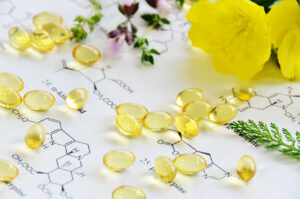 evening primrose and herbs with capsules